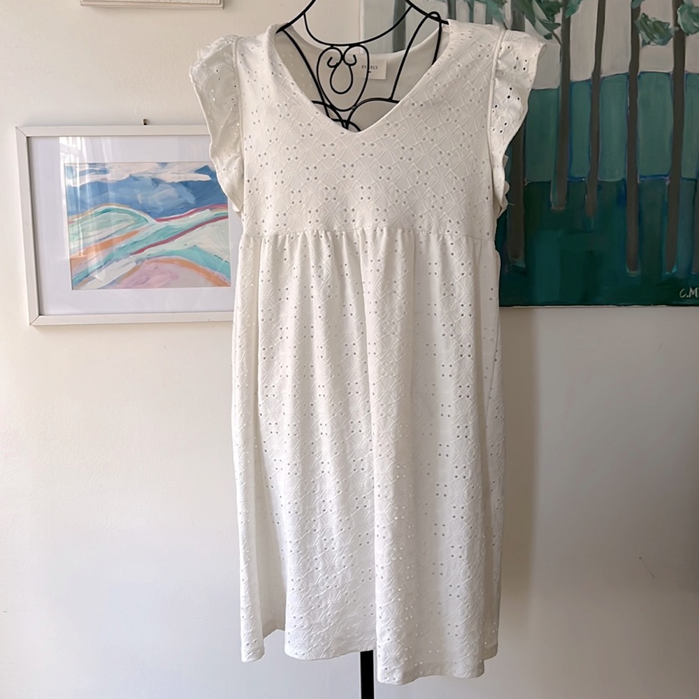 Cute eyelet dress with ruffled sleeves. Empire waste. Size L by Everly. Like new